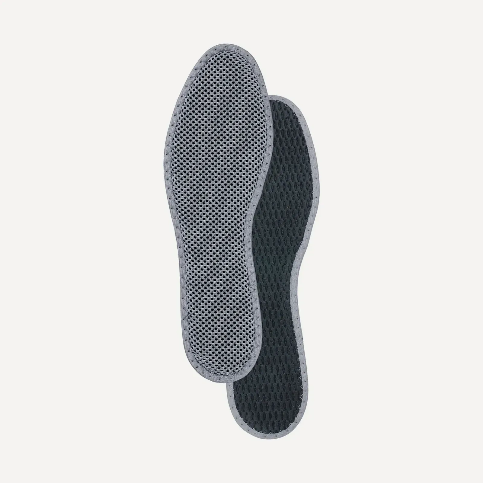 A pair of thin Pedag Activ activated-carbon insoles — light mesh over a dark layer.