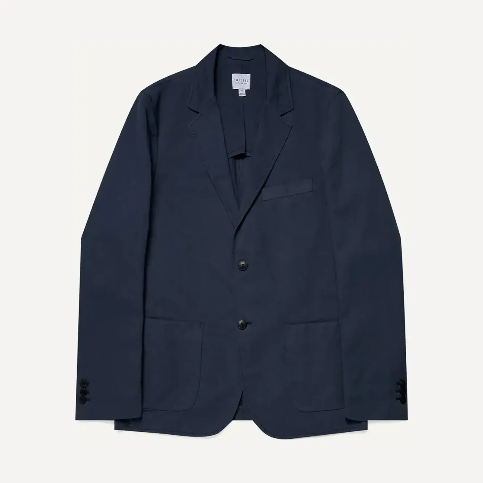 Granatowa nieusztywniona marynarka (odd jacket), ujęcie produktowe na jasnym tle.